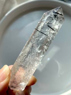 Double Terminated Black Tourmaline Rutilated Quartz, Polished Tourmalated Quartz DT shown in natural light on a light background