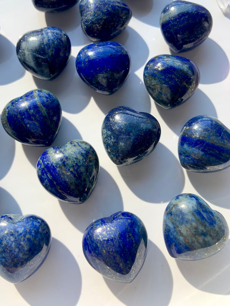 A close up view our mini sized, blue Lapis Lazuli Hearts with sparkling pyrite inclusions