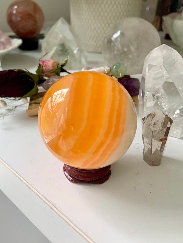 Banded Orange Calcite Sphere on Stand