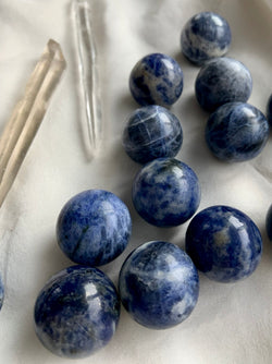 add a mini blue sodalite sphere to your crystal collection